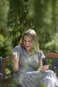 woman reading a dirty text message from her lover