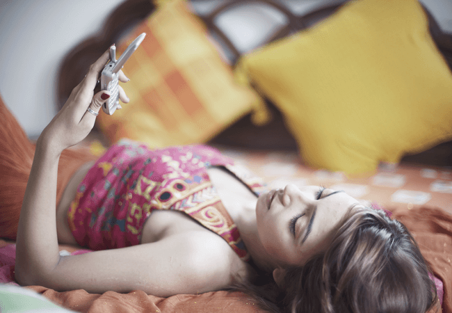 a woman looking at her cell phone