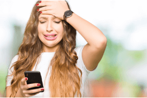 a woman realising that she sent a double text